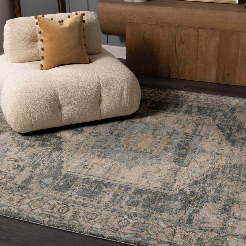 Living room scene with a beige chair on a Vaeda Blue Thick Luxe Rug. The rug has blue, beige, and gray tones. Roomscene-Rectangle