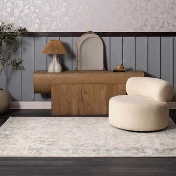 Living room scene with a beige chair on the Ahmaud Beige & Light Gray Thick Luxe Area Rug. Farmhouse style. Roomscene-Rectangle