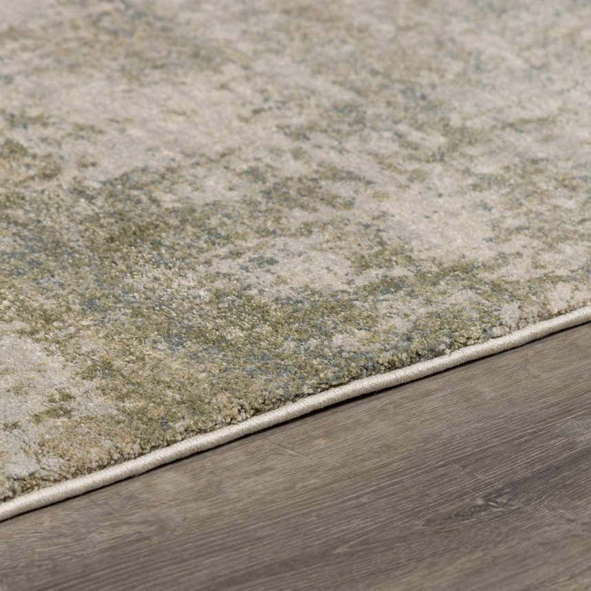 Close-up of the Zazie Thick Luxe Rug showing its beige, gray, and olive abstract pattern and plush texture. Pile