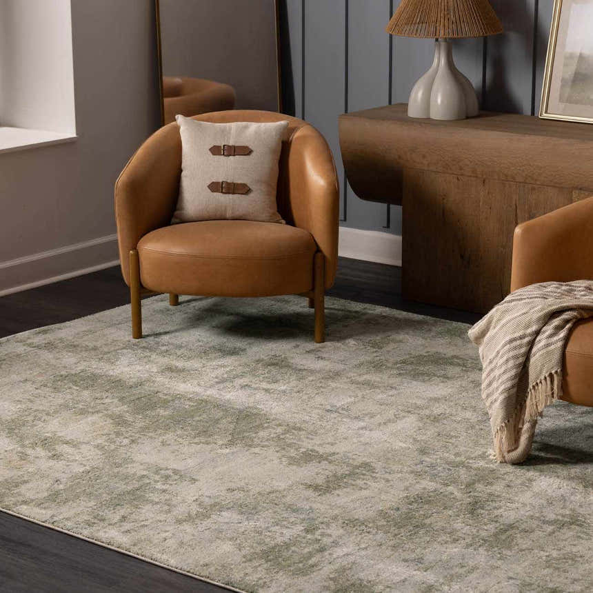 Living room scene with beige leather chairs and the Zazie Thick Luxe Rug in beige and olive. Roomscene-Rectangle