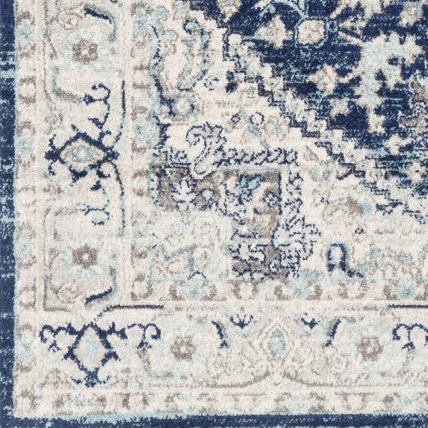 Close-up of the Livabliss Chester rug. Machine woven polypropylene rug in beige, charcoal, navy, and sky blue. Farmhouse style. Swatch