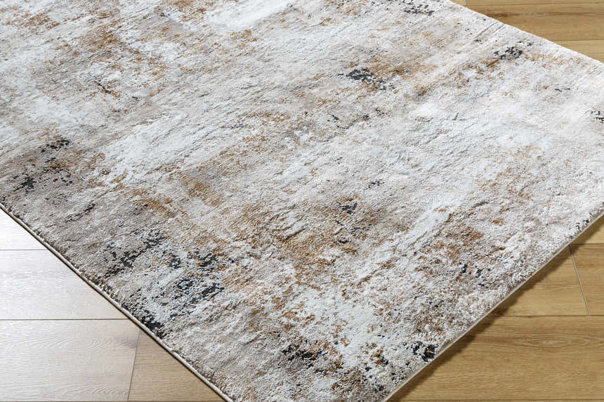 Close-up of a Weeko Luxe Thick Area Rug showing its ivory, tan, and black contemporary design. Corner