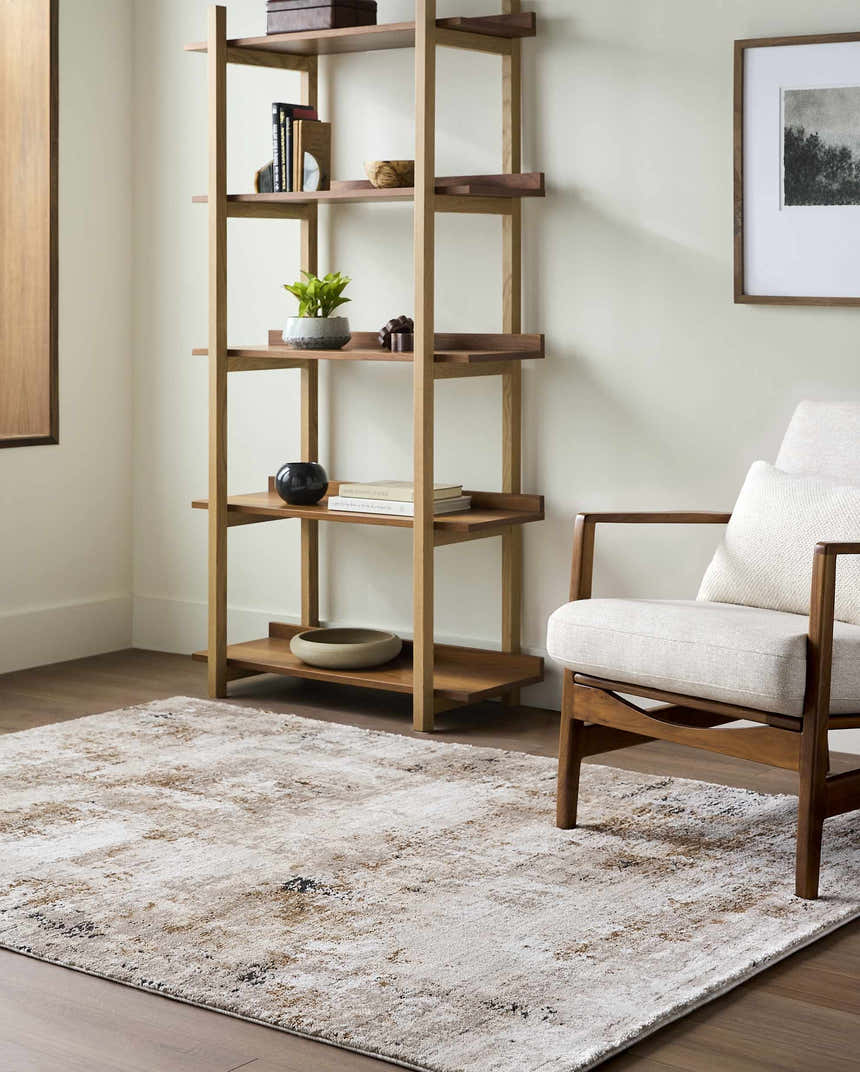 Living room scene with Weeko Luxe Thick Area Rug in ivory, tan, and black, styled with a wood chair and bookshelf. Roomscene-Rectangle