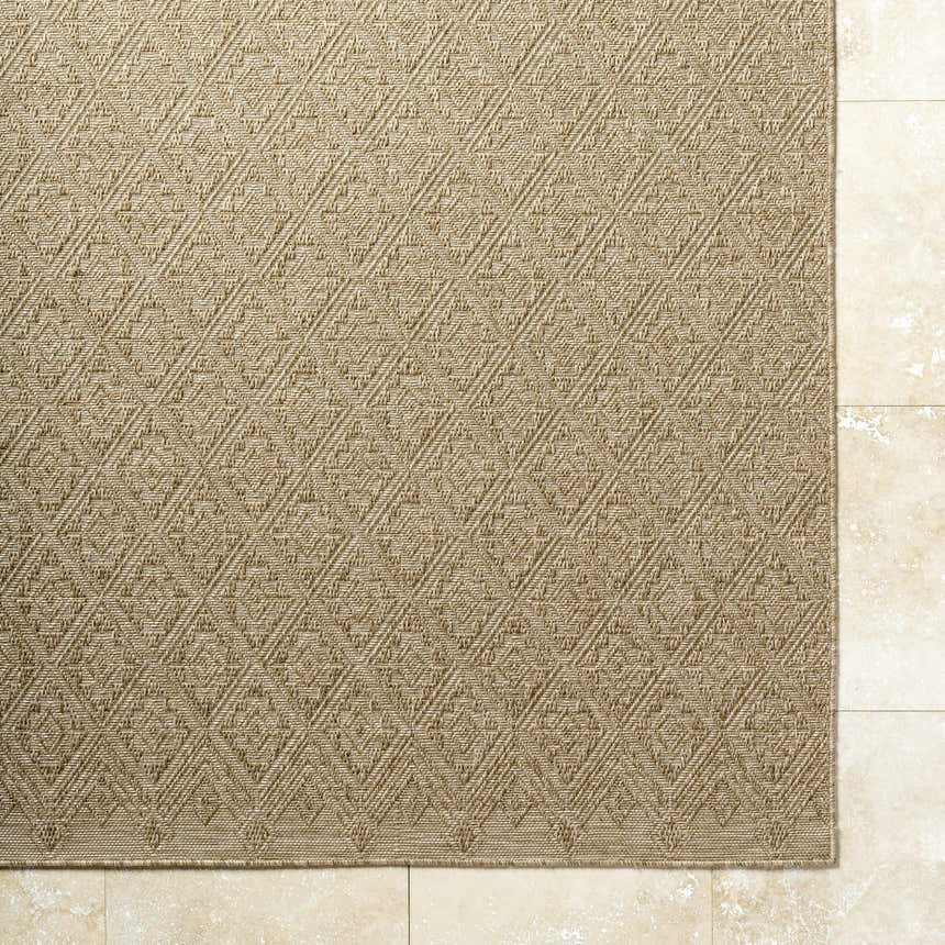 Close-up of the Bandit Brown Area Rug showing its woven diamond pattern and tan, camel, and prairie dust colors. Corner
