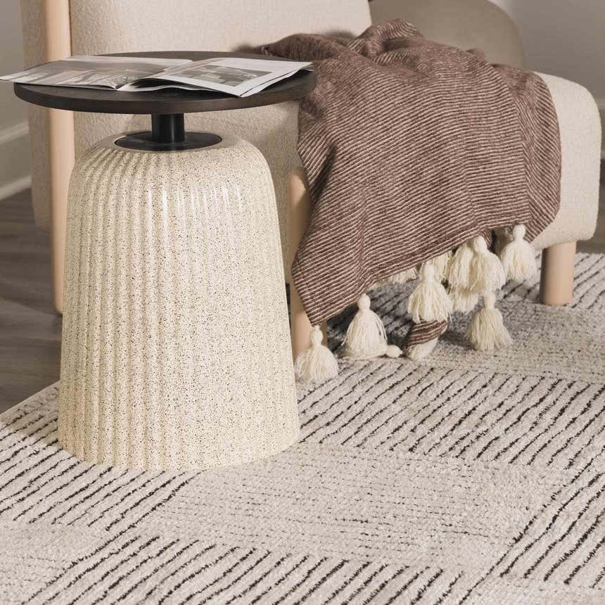 Close-up of the Modern Scandi High Pile Architect I Area Rug in ivory and black with geometric line pattern. Styleshot