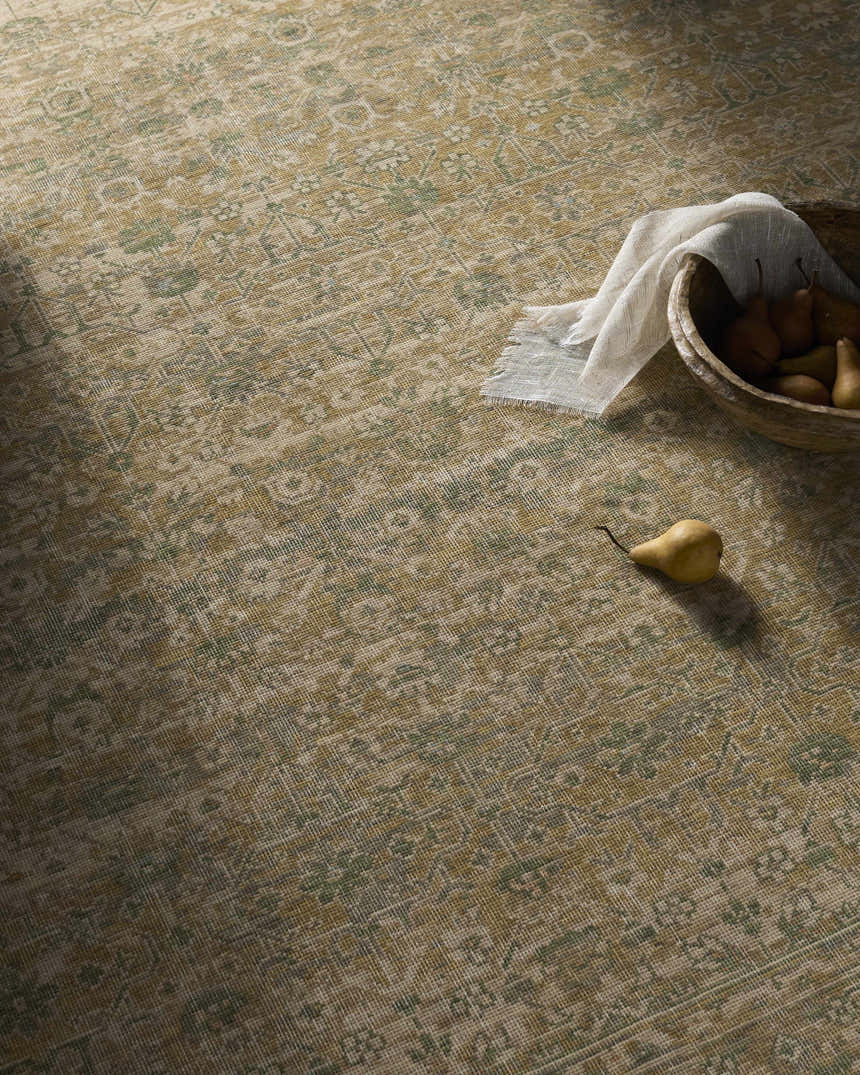 Close-up of the Becki Olive Owens x Livabliss Renaissance Area Rug; beige, olive, and tan traditional pattern. Styleshot