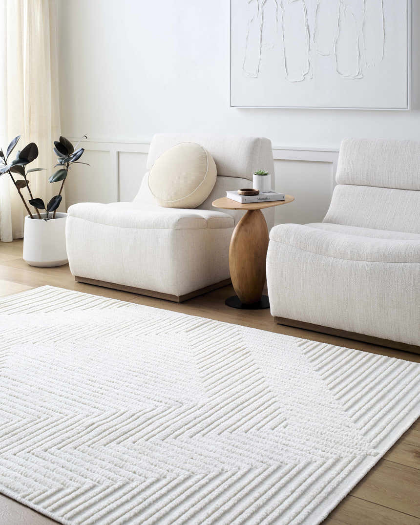 Minimalist living room with two chairs and Briana Off-White Washable Area Rug with geometric pattern. Roomscene-Rectangle