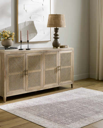 Entryway with a Spokane Dark Brown Area Rug, light wood floors, and a matching cabinet with decor. Roomscene-Rectangle