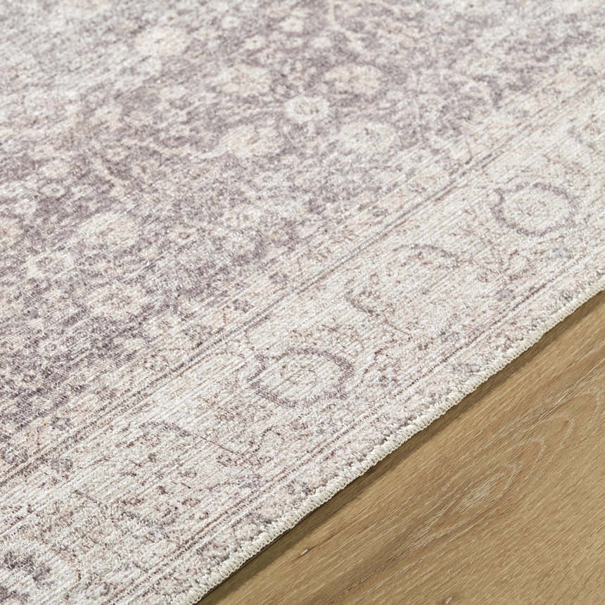 Close-up of the Spokane Dark Brown Area Rug showing its traditional cream and dark brown floral pattern and soft texture. Texture
