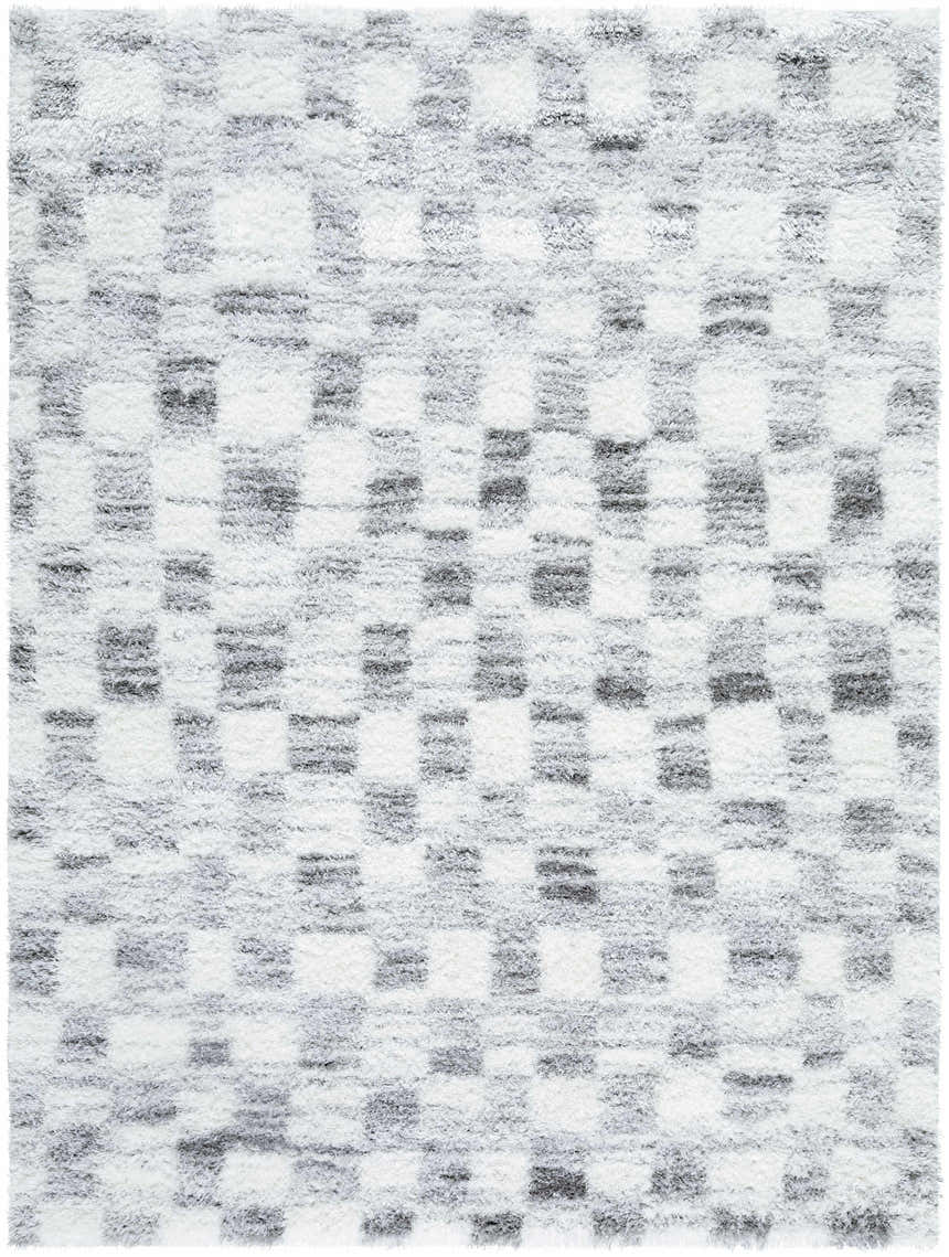 Close-up of the Aneska Area Rug, a gray and ivory shag rug with a contemporary geometric pattern. Design-Rectangle-537