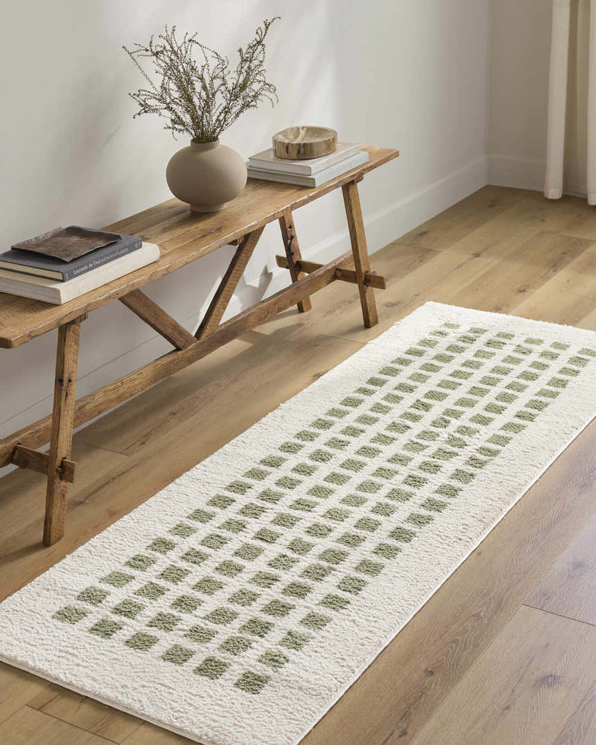 Entryway scene with a Baback Green Washable Area Rug runner, wood bench, light wood floors, and neutral walls. Roomscene-Runner