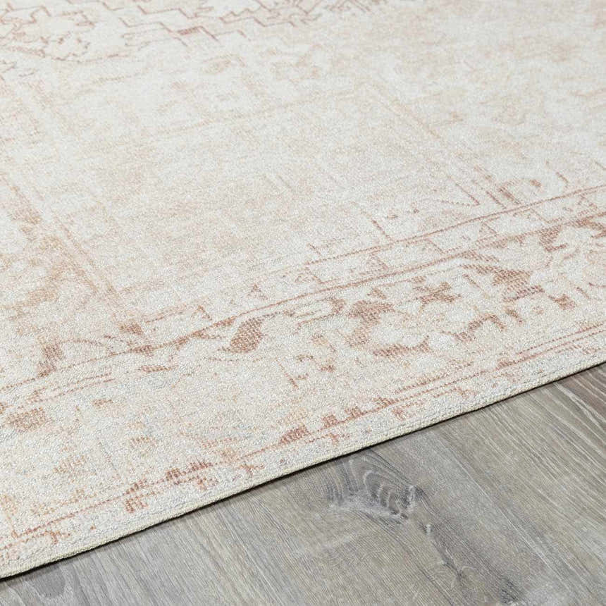 Close-up of Galey Alix Collins Avenue V Vintage Medallion Rug. Beige rug with dark red and light gray traditional pattern. Pile