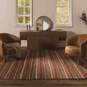 Entryway with leather chairs and the striped Brenda Indigo Area Rug in charcoal, indigo, ivory, mustard, olive, rust, and tan. Roomscene-Rectangle