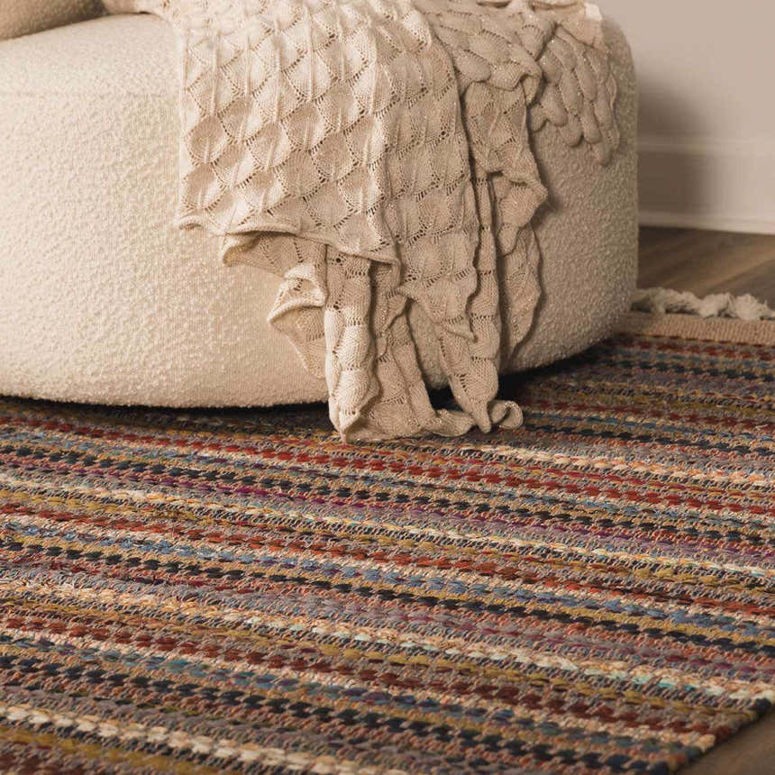 Close up of the hand woven Brenda Crimson Area Rug with colorful stripes and a textured weave. Roomscene-Rectangle