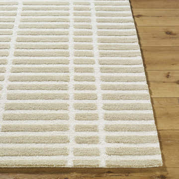 Close-up of the Bendek Beige Area Rug, a hand-tufted wool rug with a contemporary beige and ivory block pattern. Front