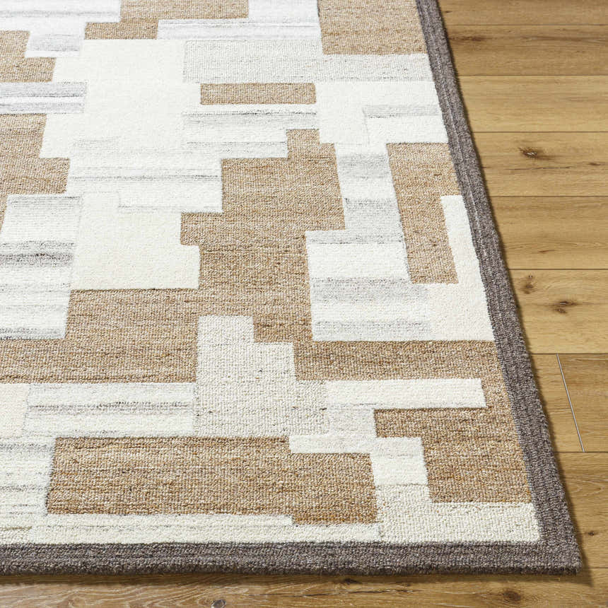 Close-up of the hand-tufted Berker Area Rug. Beige, cream, and charcoal wool rug with a contemporary geometric pattern. Front