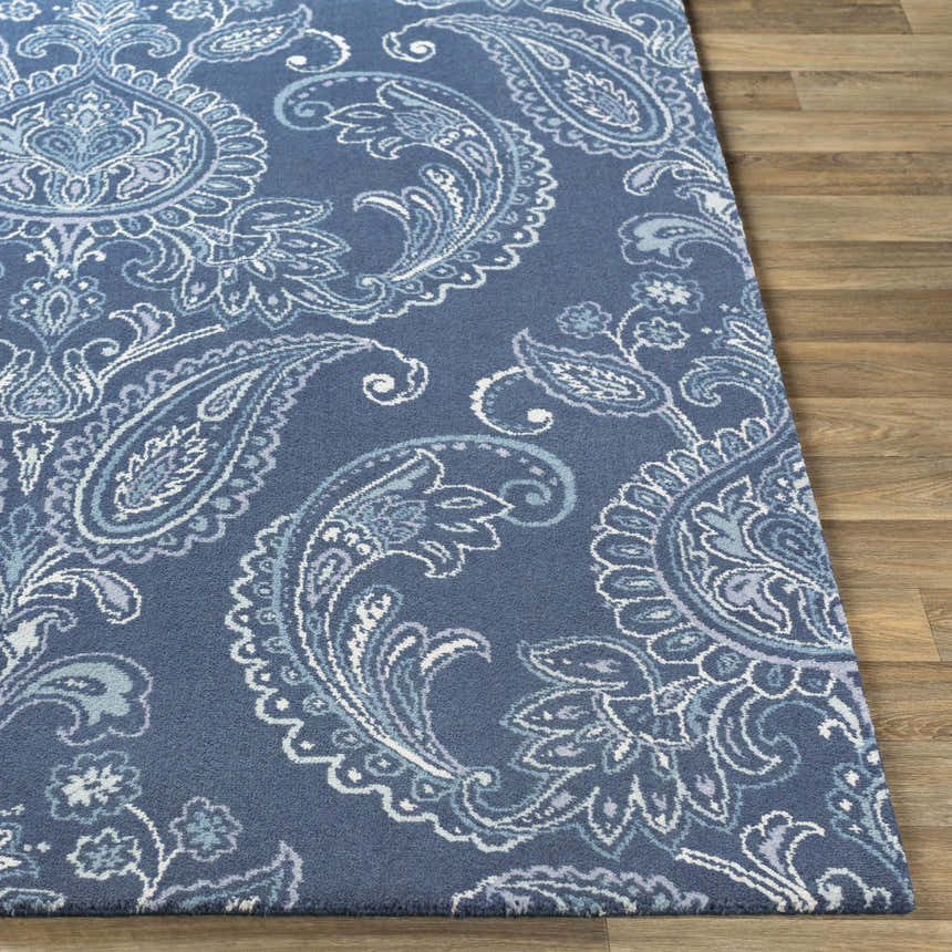 Close-up of the Simpatico Candice Olson x LIVABLISS SPO-1000 Area Rug. Features a blue paisley pattern on a wool rug. Front