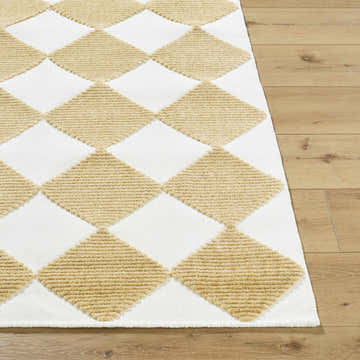 Close-up of the Bosley White Washable Area Rug. Mustard diamond pattern on a white background. Contemporary style. Front