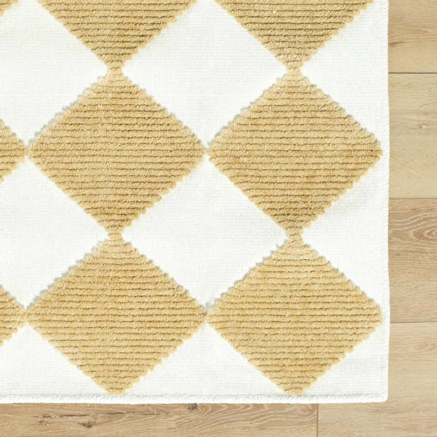 Close-up of Bosley White Washable Area Rug. Mustard and white diamond pattern, machine woven texture. Contemporary style. Swatch