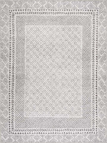 Close-up of Burdette Washable Area Rug. Charcoal and light beige rug with farmhouse, Moroccan, and transitional geometric pattern. Design-Rectangle-5373