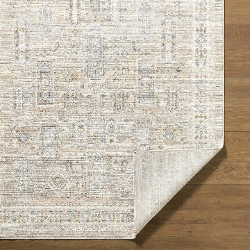 Close-up of Fugia Beige Persian rug showing its traditional pattern, soft texture, and machine-woven construction. Fold