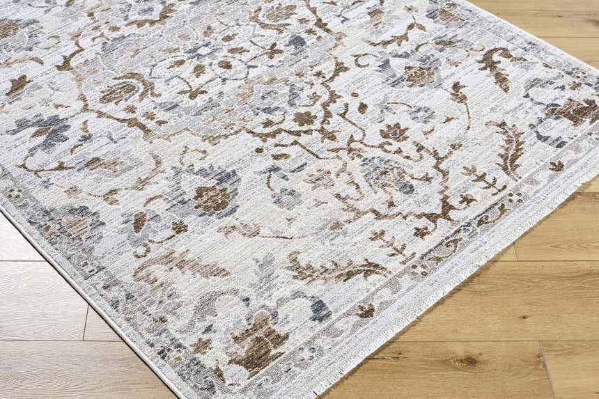 Close-up of the Aldona Area Rug showing its traditional floral pattern in charcoal, ivory, slate gray, and taupe. Corner
