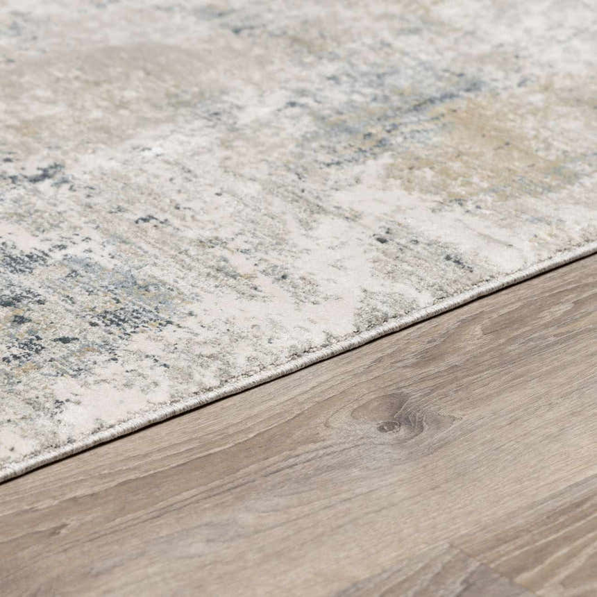 Close-up of Burstwick Thick Luxe Boutique Rug showing its dusty sage, navy, and taupe contemporary pattern and soft texture. Pile