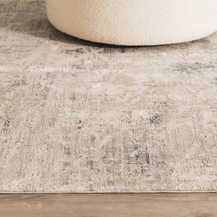 Close-up of the Burstwick Thick Luxe Boutique Rug showing its dusty sage, navy, and taupe colors and textured, contemporary design. Styleshot