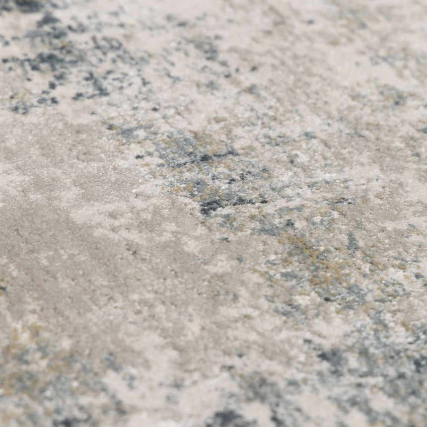 Close-up of the Burstwick Thick Luxe Boutique Rug showing its abstract pattern and neutral colors with hints of navy and taupe. Texture