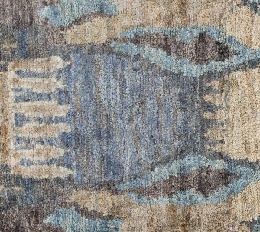 Close-up of the Bushong Jute Carpet. Hand-knotted Southwestern design in blue, brown, gray, and white jute fibers. Swatch