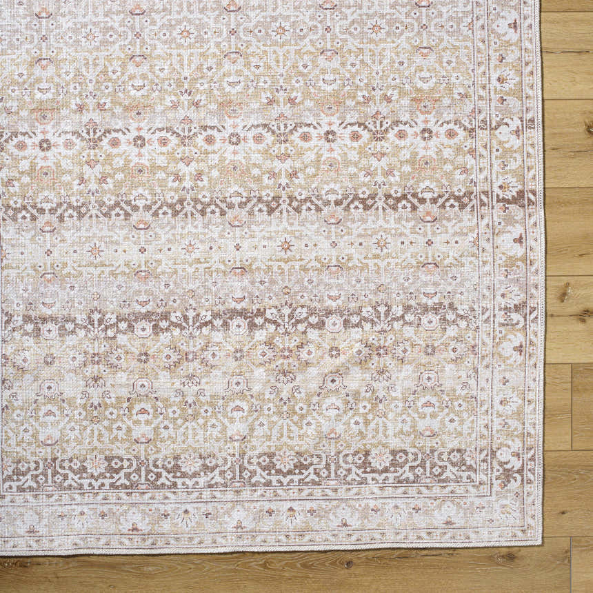 Close-up of Bienna Vintage Flat Pile Washable Rug showing camel, cream, and brown traditional pattern and flat pile texture. Corner