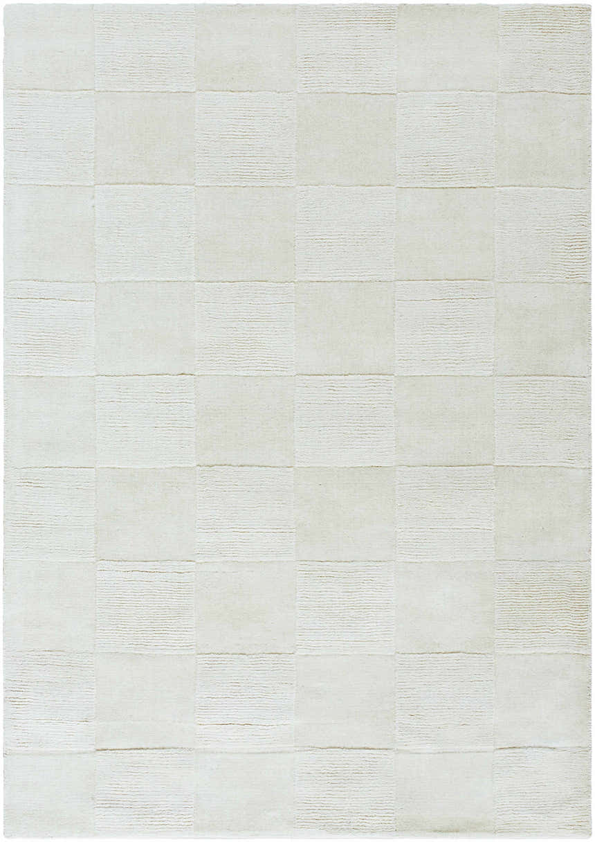 Close-up of the light silver Canice Area Rug, a hand-loomed wool rug with a subtle checkerboard pattern. Design-Rectangle-5377