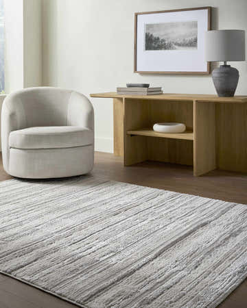 Living room scene with neutral decor and Cardea Area Rug in cream, ivory, and gray. Contemporary style. Roomscene-Rectangle