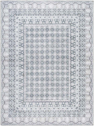 Close-up of the Rainier Gray Washable Rug. Farmhouse style rug features a traditional geometric pattern in off white, pale blue, and sage. Design-Rectangle-5373