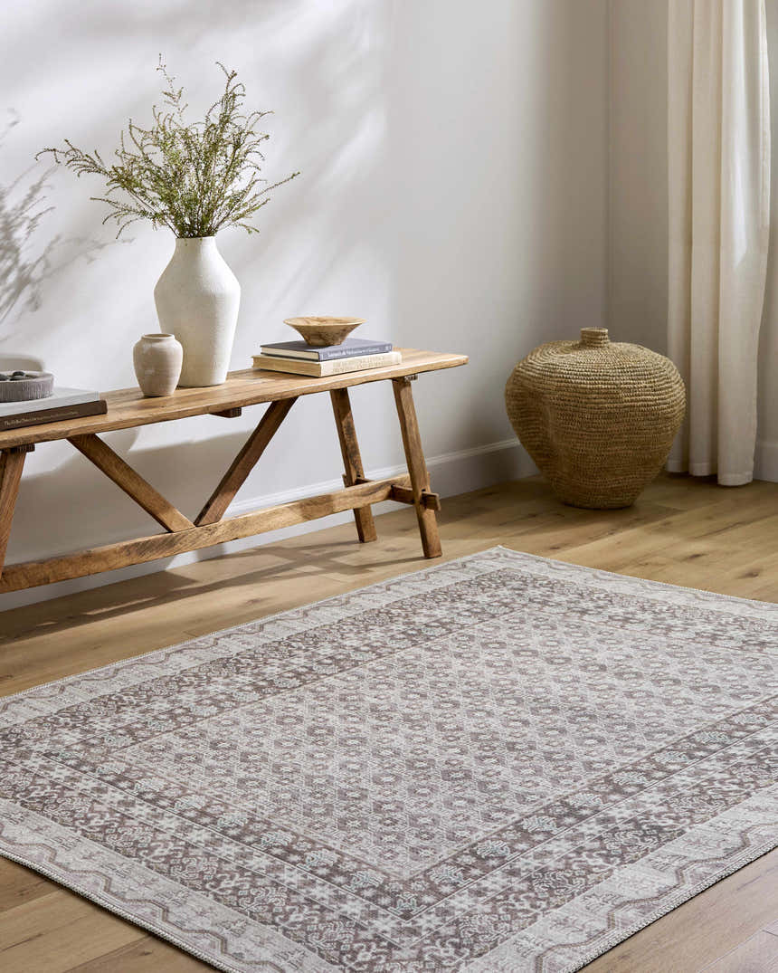 Entryway with Rainier Brown Washable Rug, wood bench, vases, books, and woven basket for a farmhouse feel. Roomscene-Rectangle