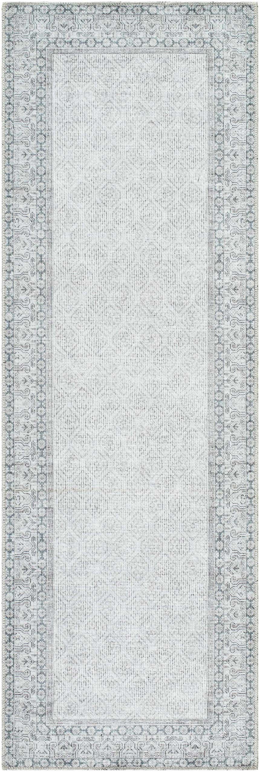 Close-up of Rainier Cottage Border Gray Washable Rug. Farmhouse style rug with blue border and geometric pattern. Design-Runner-27710