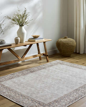 Entryway with Rainier Cottage Border Beige Washable Rug, wood bench, vases, and woven basket for a farmhouse feel. Roomscene-Rectangle