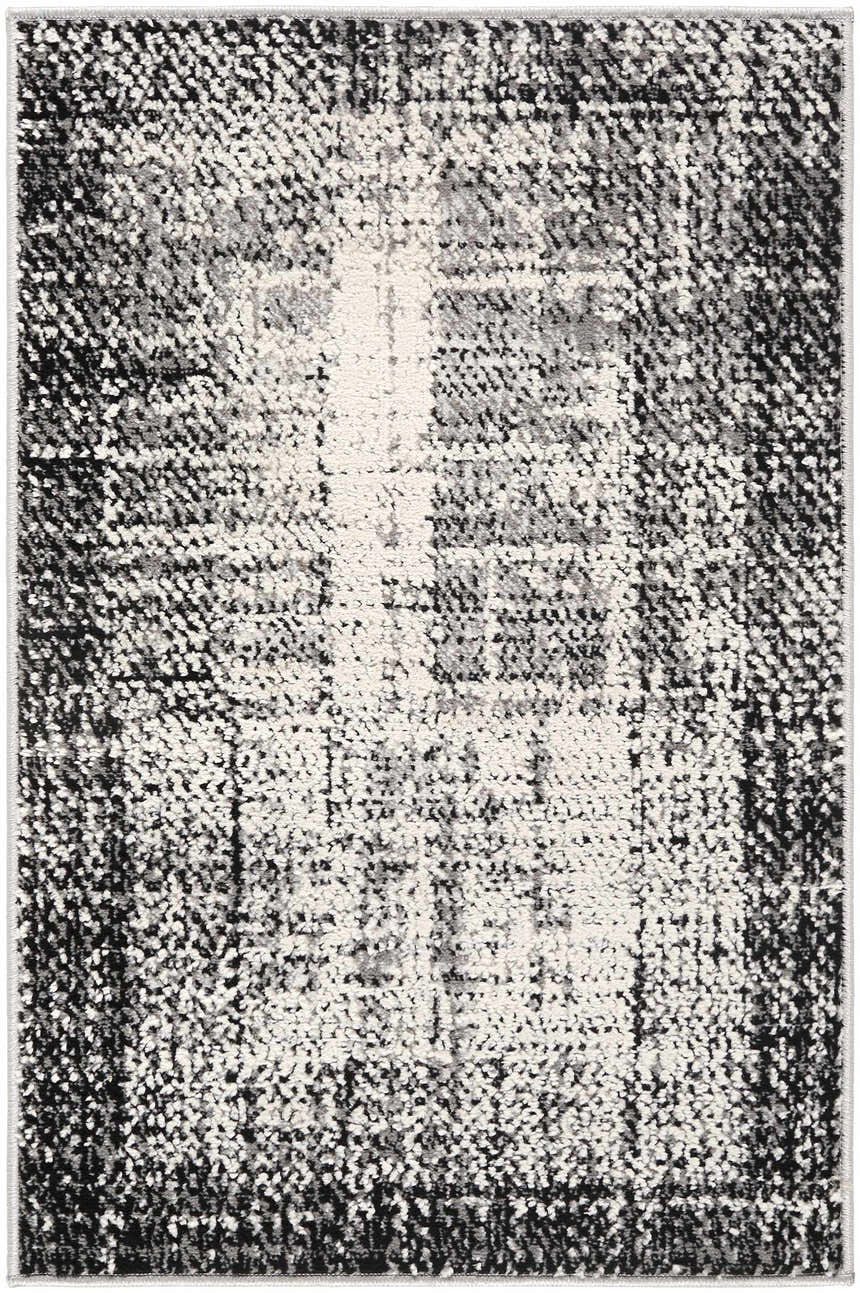 Close-up of the Colson Gray Area Rug showcasing its light silver, onyx, and silver gray contemporary design. Design-Rectangle-23