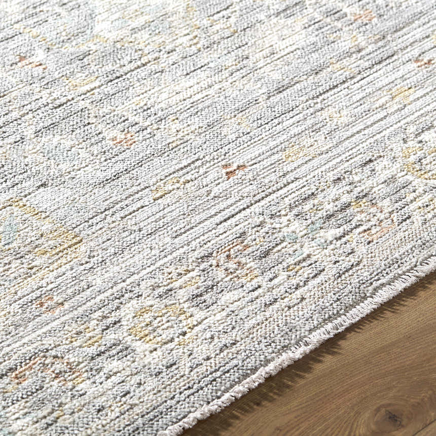 Close-up of the machine woven Xiye Silver Medallion rug, showing its texture and farmhouse style pattern. Texture