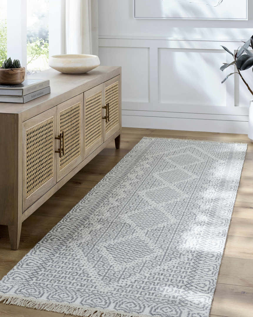 Entryway with light wood console and gray geometric Claus Area Rug runner on wood floor. Roomscene-Runner