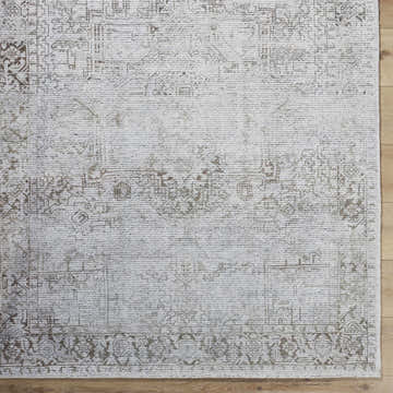 Close up of the hand tufted Clodia Area Rug, showcasing its charcoal, ivory, and taupe traditional pattern. Swatch