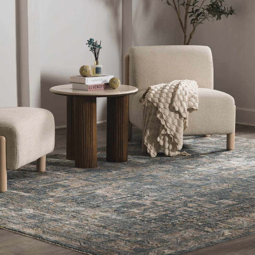 Living room scene with a Mirabel Denim Blue Traditional Rug, cream chair, and wood accent table. Roomscene-Rectangle