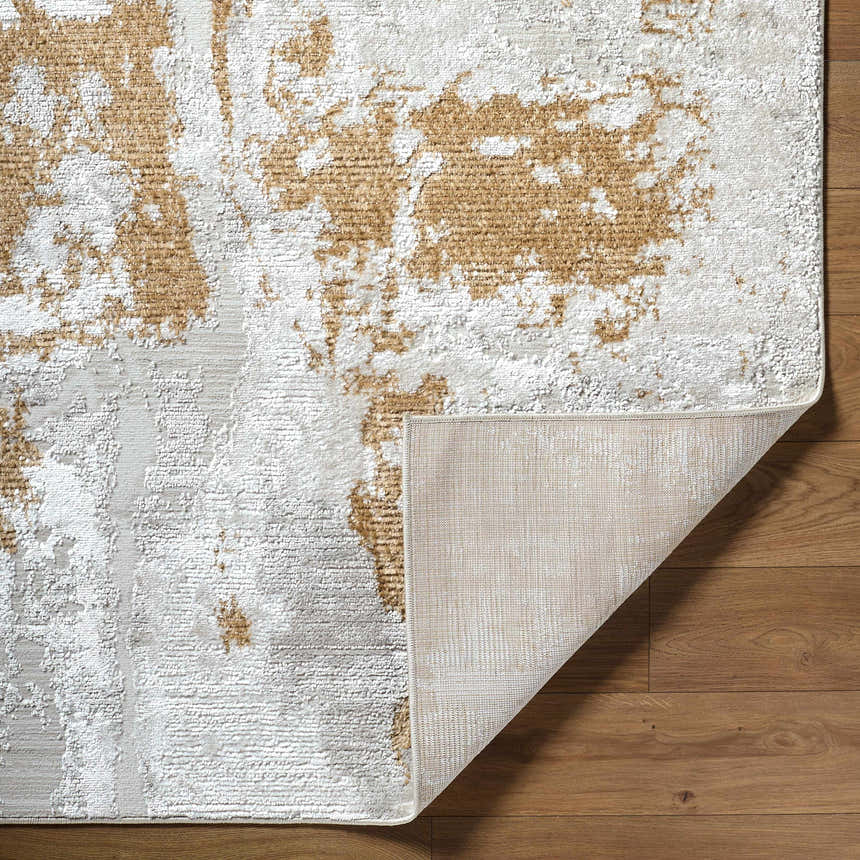 Close up of Chroma Area Rug showing ivory, light gray, and mustard abstract pattern and machine woven texture. Fold
