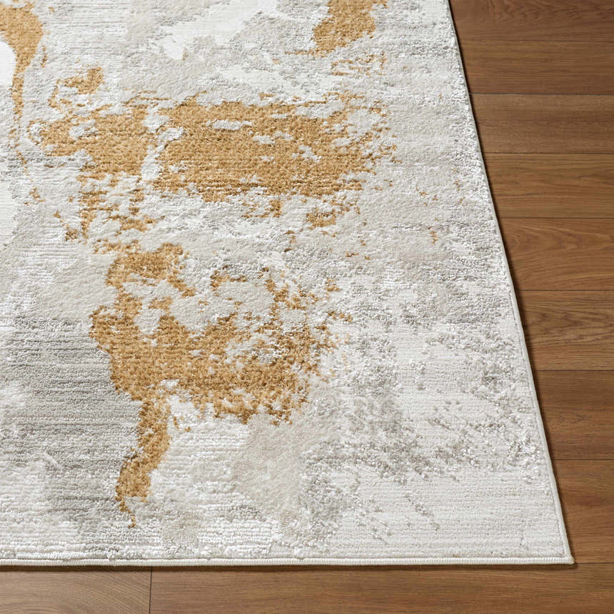 Close-up of the Chroma Area Rug showing its ivory, gray, white, and mustard contemporary design and soft texture. Front