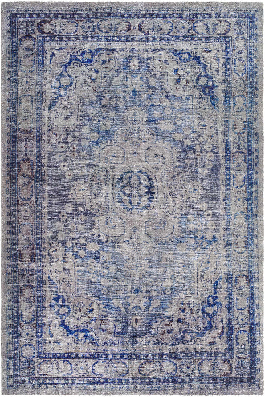 Close-up of the hand-tufted Csilla Area Rug. Traditional design in arctic sky, blue, ivory, and slate blue. Design-Rectangle-576