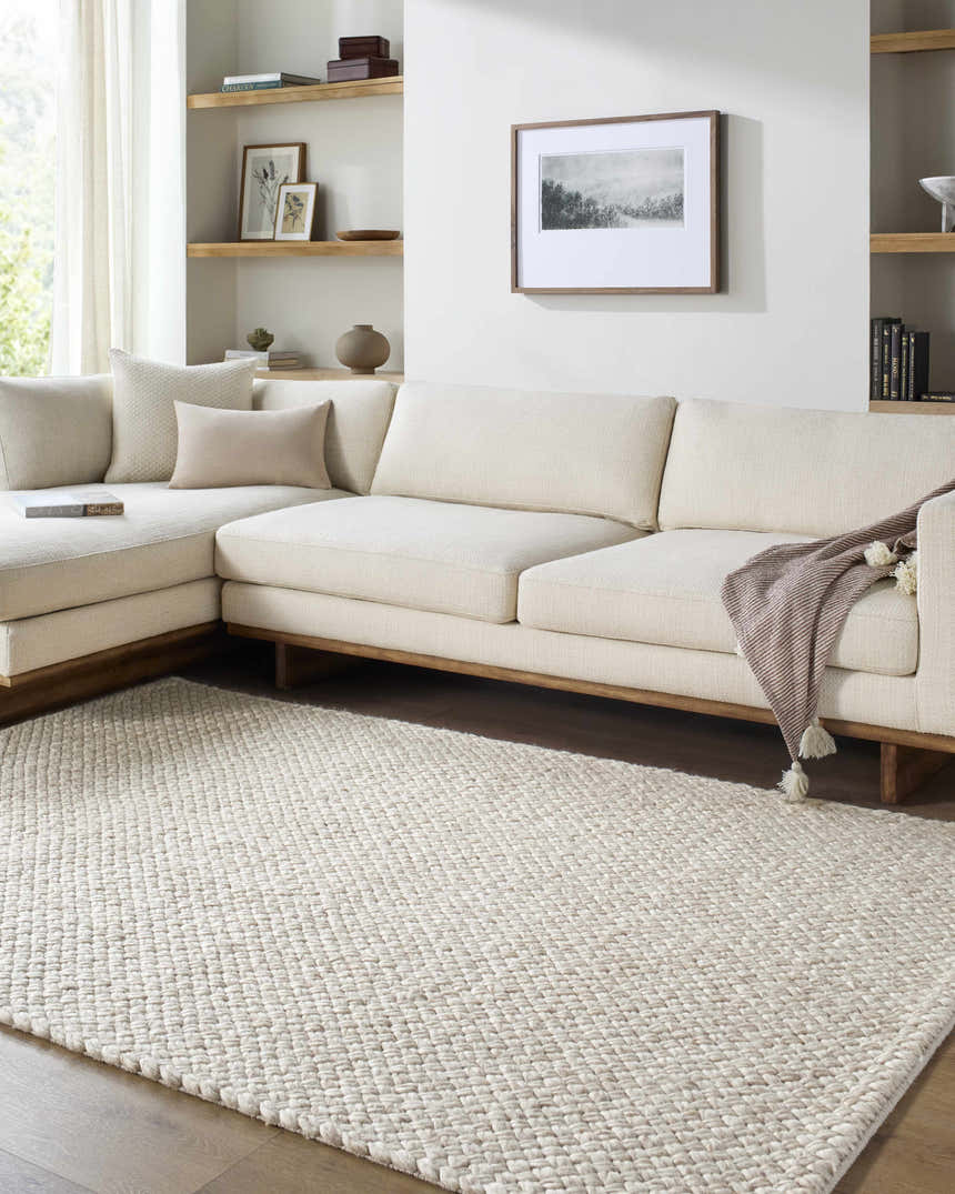Living room scene with ivory sectional sofa and Rowue Ivory Solid Hand Woven Wool Area Rug. Farmhouse style. Roomscene-Rectangle