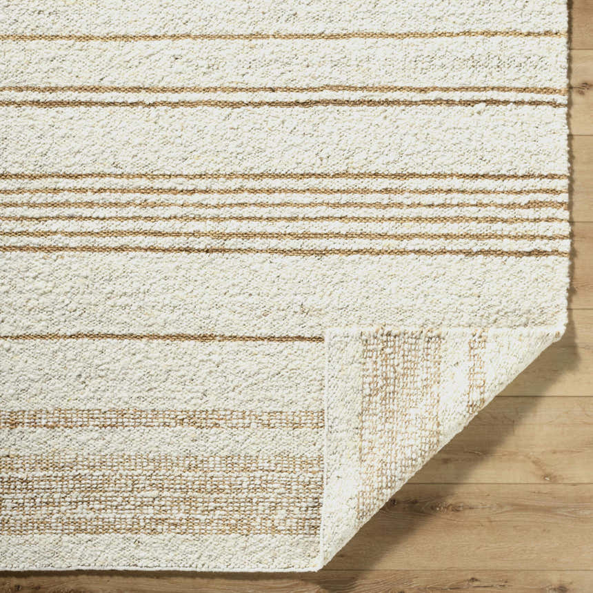 Close-up of the hand-woven Ciaran Area Rug. Ivory wool rug with sandstone stripes and a textured, transitional design. Fold