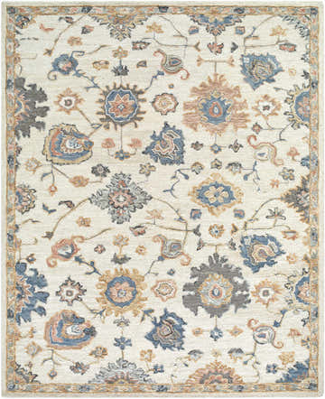 Close-up of the Candid Oushak Area Rug, a cream wool rug with light brown, steel blue, and gray floral and vine pattern. Design-Rectangle-810