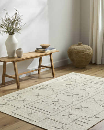 Neutral living room with wood bench and beige Chanda Area Rug featuring a geometric design. Roomscene-Rectangle