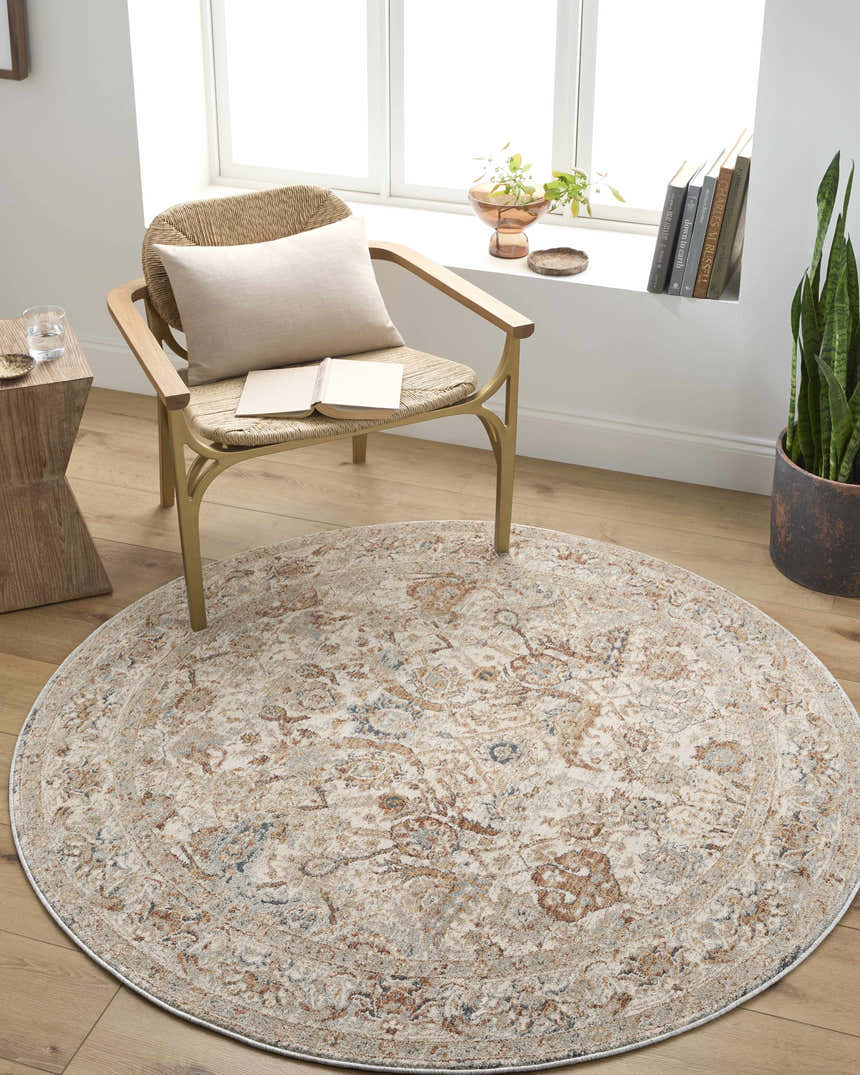 Cozy reading nook with a round Chikao Cream Area Rug, woven chair, and natural light from the window. Roomscene-Round